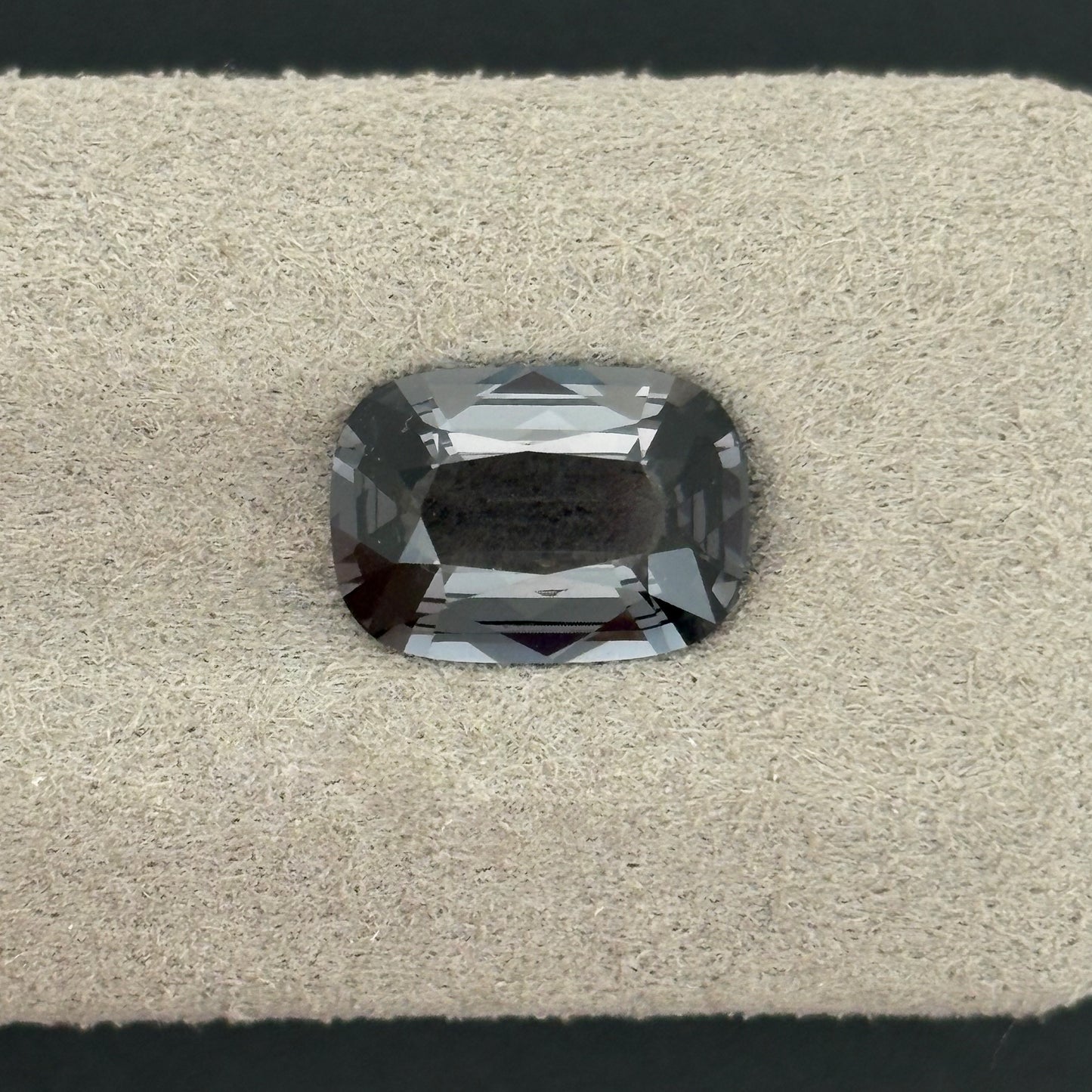 2.35 Carat Metallic Gray Spinel Cushion Cut on Display Tray
